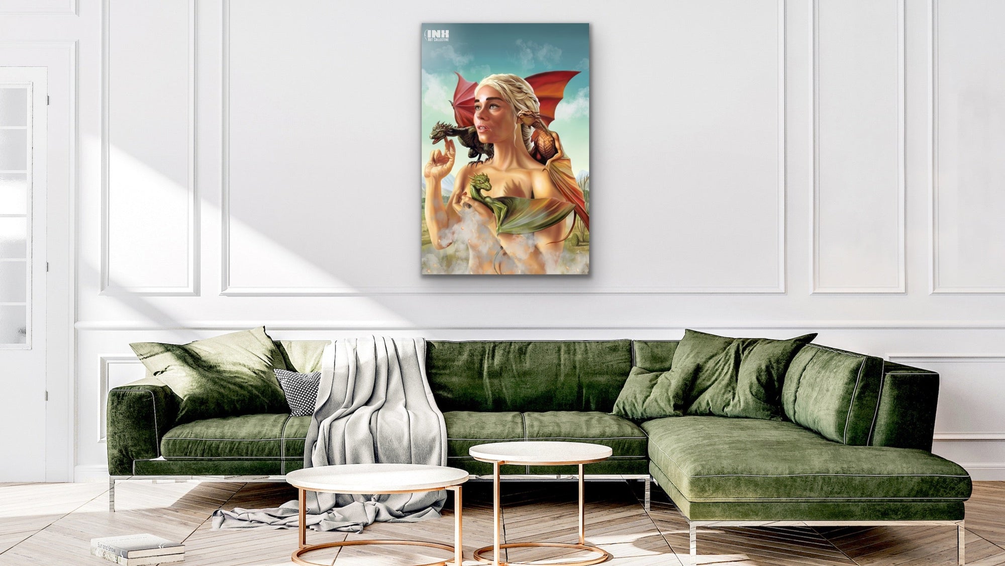 Framed artwork of  the mother of dragons on a wall above a green sofa.